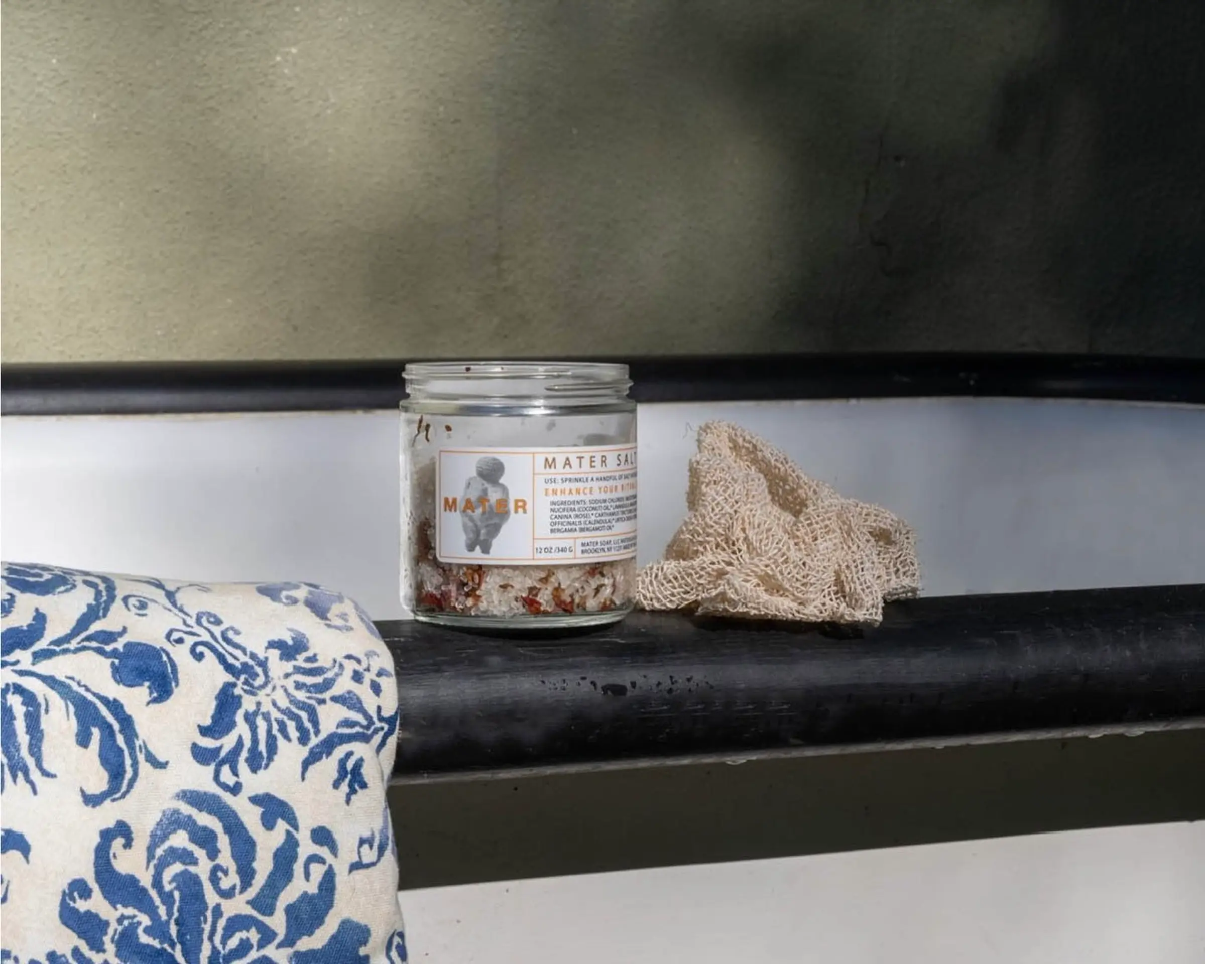 Mater salt soak on the edge of a bathtub