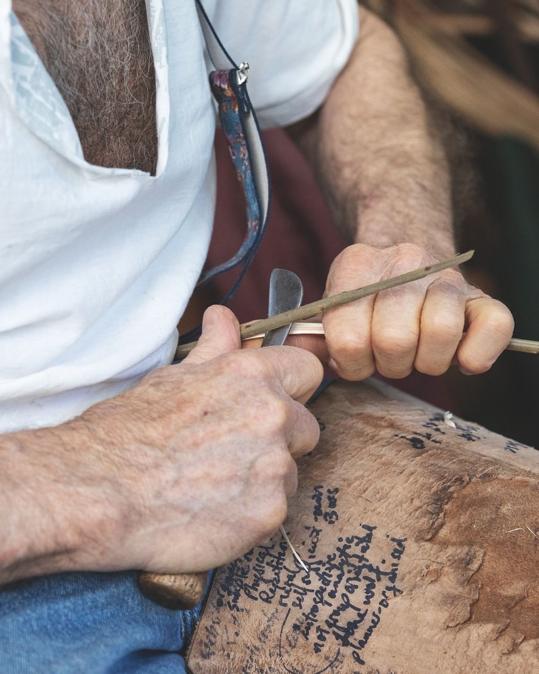 Mike Lilian, basket maker peeling willow in his workshop