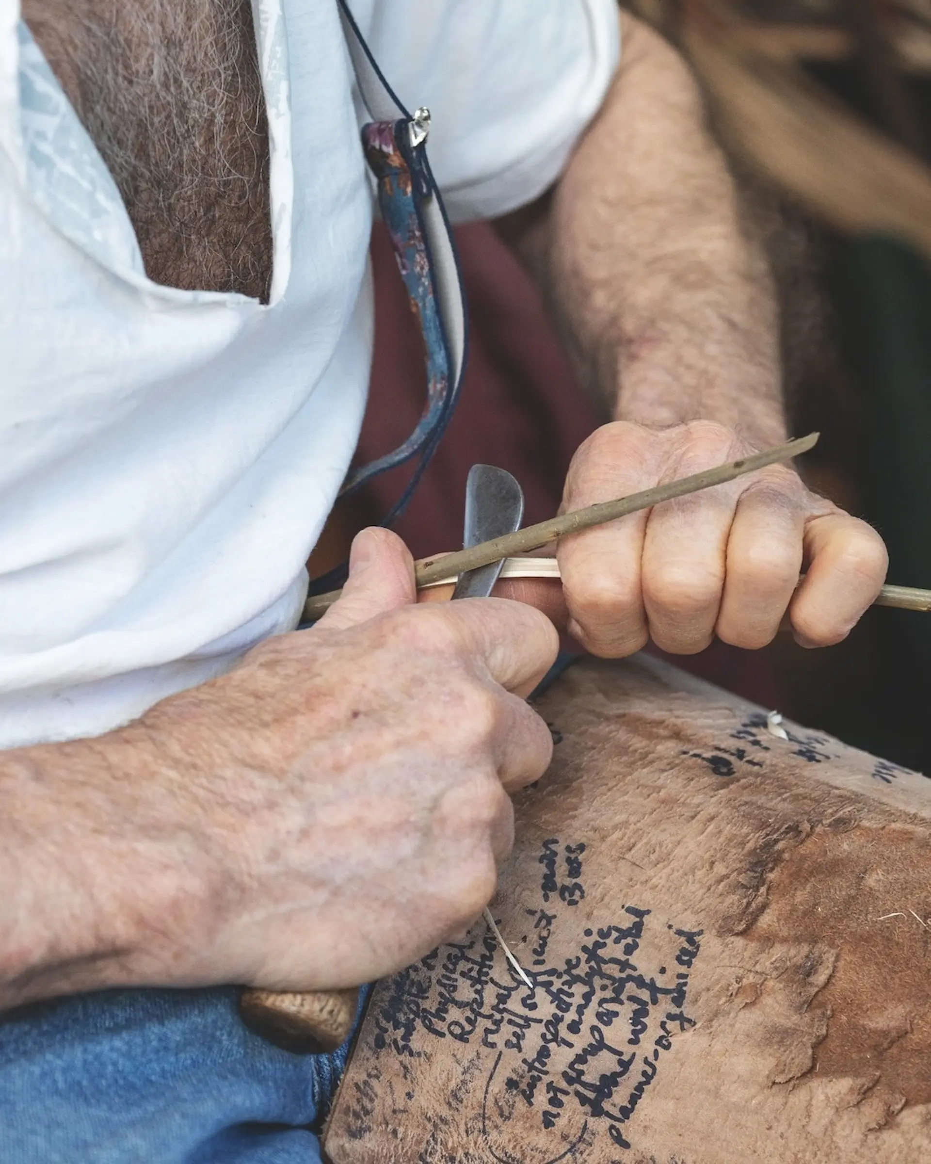 Mike Lilian, basket maker peeling willow in his workshop