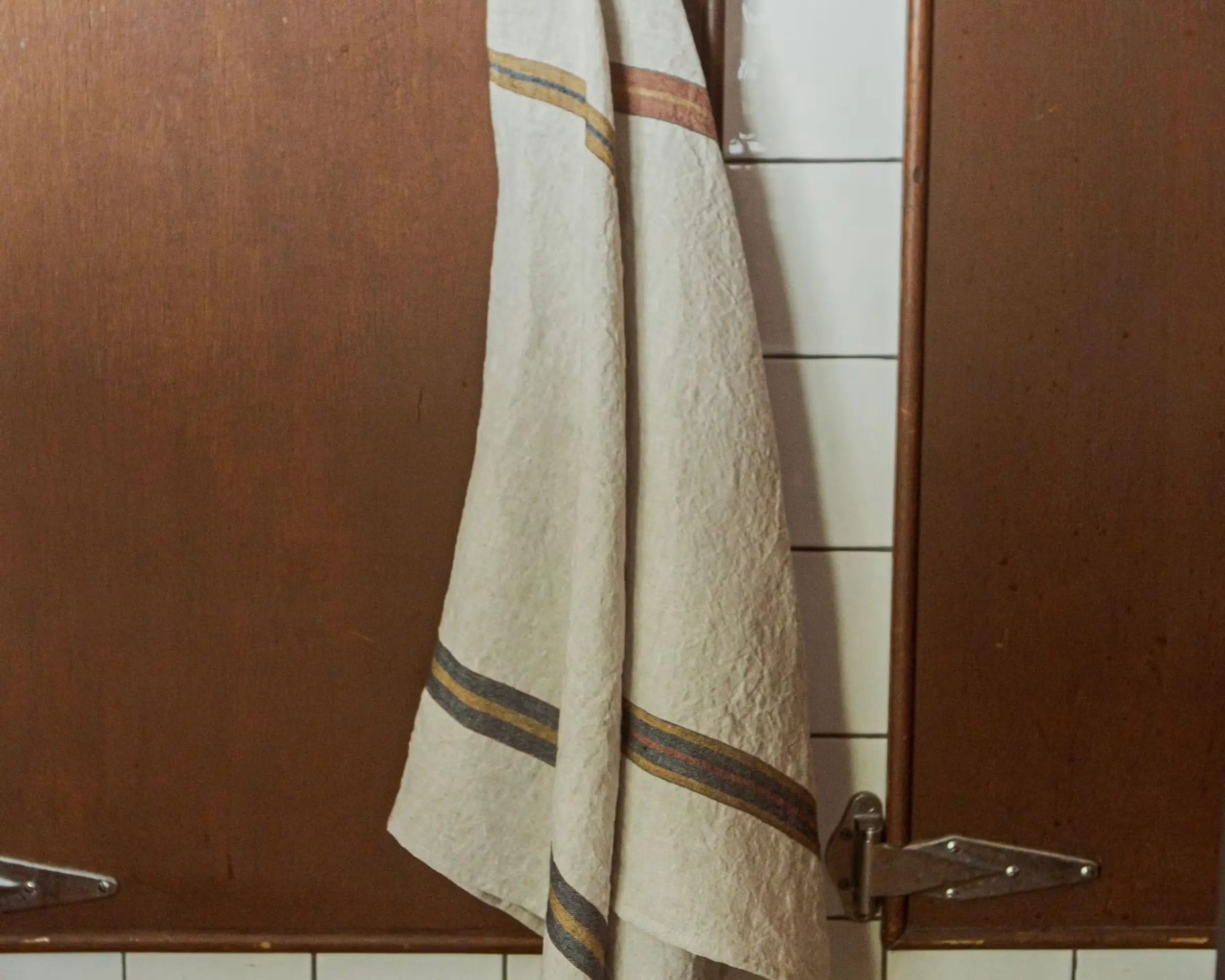 Two belgian linen tea towels from Libeco made from premium linen with stripe detailing on a cream background
