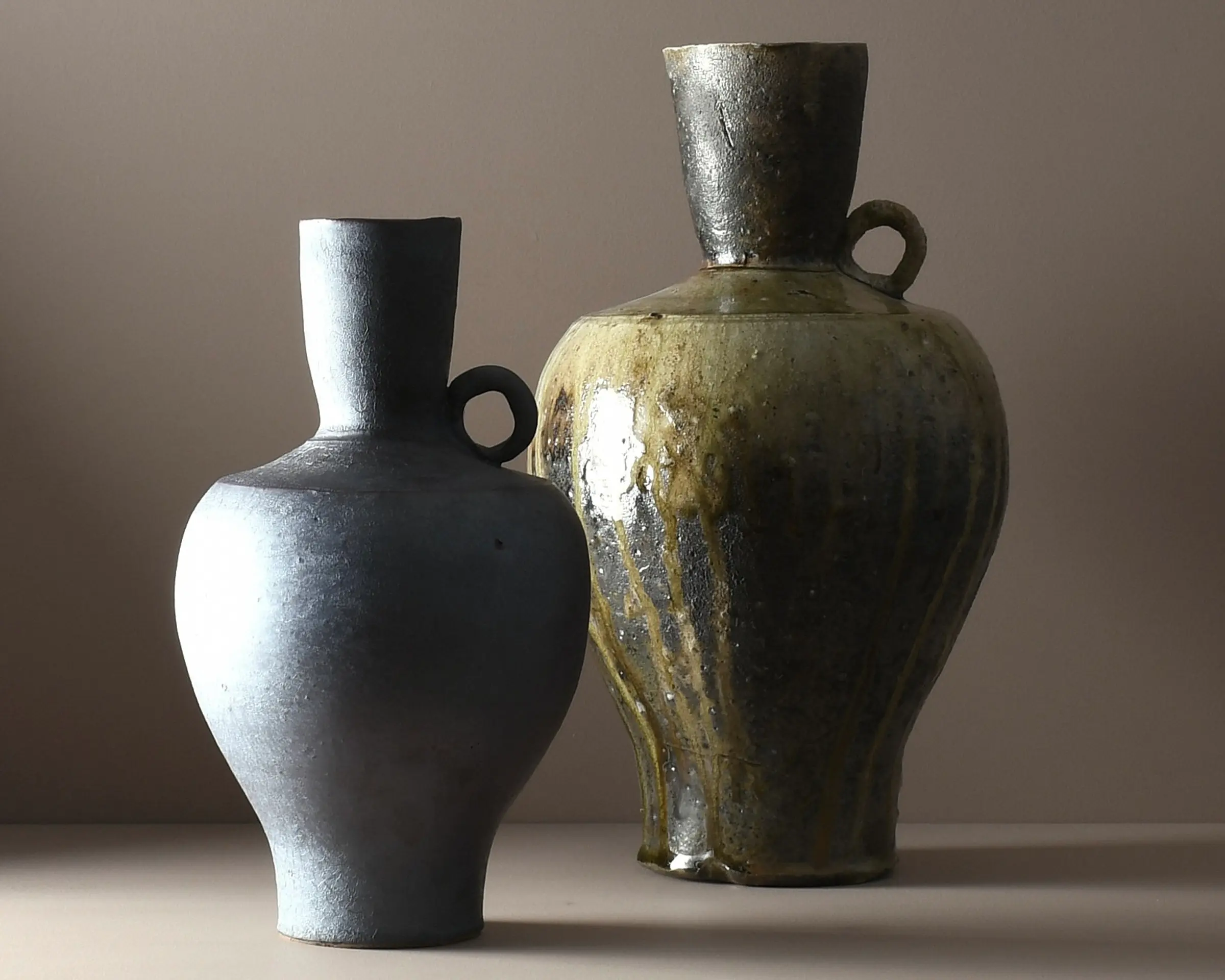 A one-of-a-kind fluted stoneware vase by Aotearoa ceramic artist Holly Rose Morgan, glazed with silt collected in the aftermath of Cyclone Gabrielle in Te Matau a Māui, Hawke’s Bay.