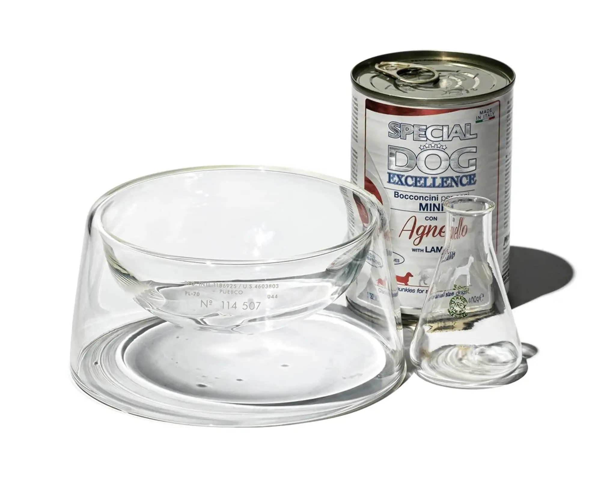 a shot of the glass pet bowl with a can of dog food next to it from Puebco