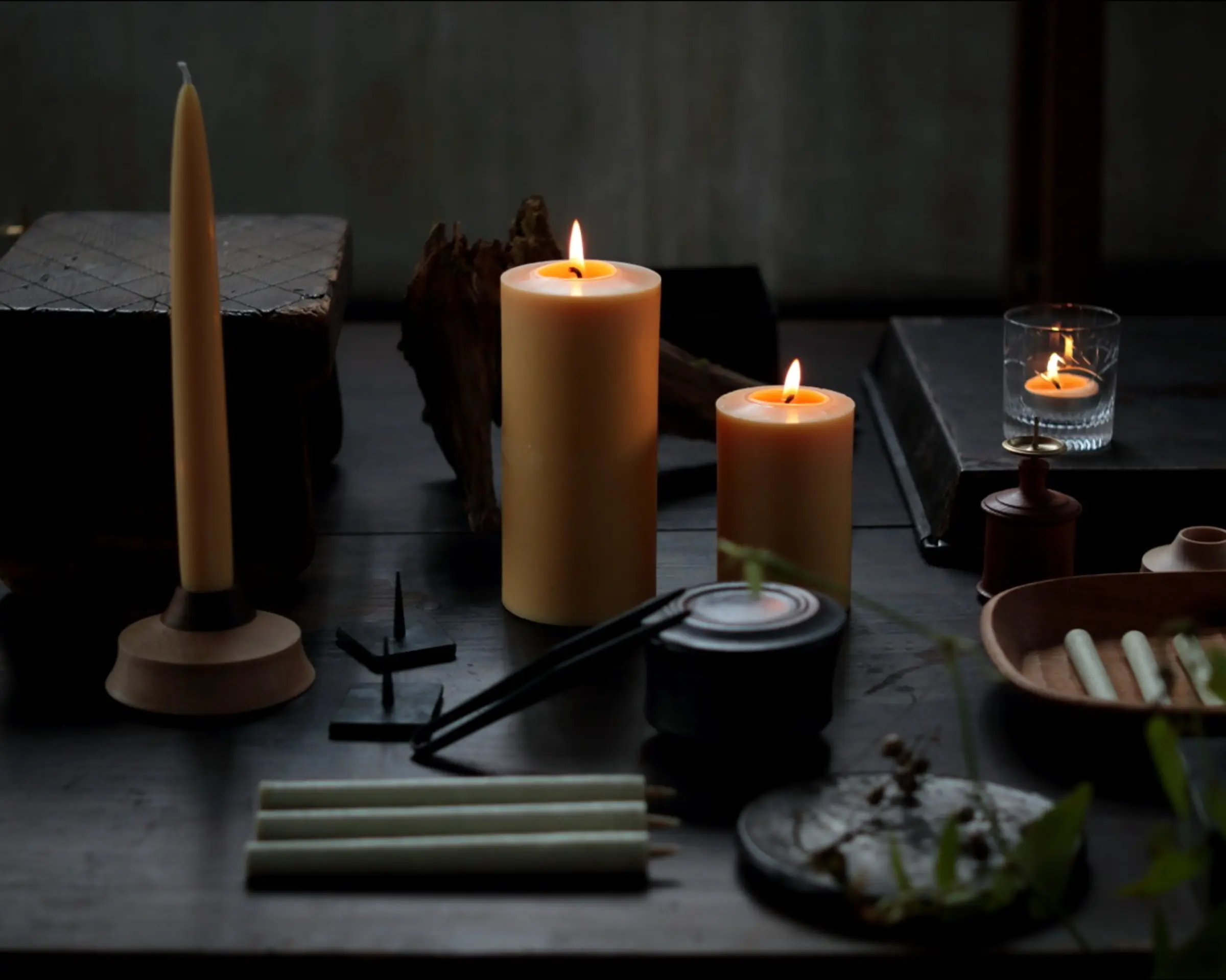 a collection of daiyo candles on a table