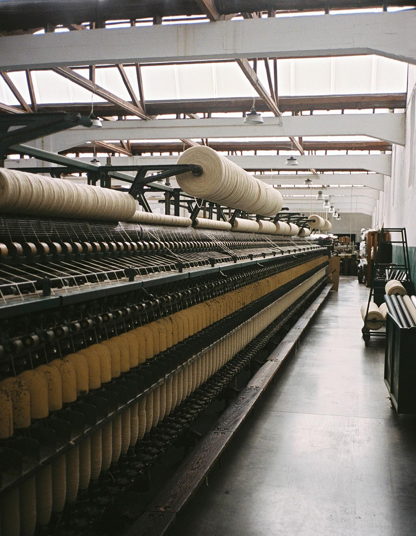 Wool spools lined up on 19th century refurbished weaving mills from Burel Factory