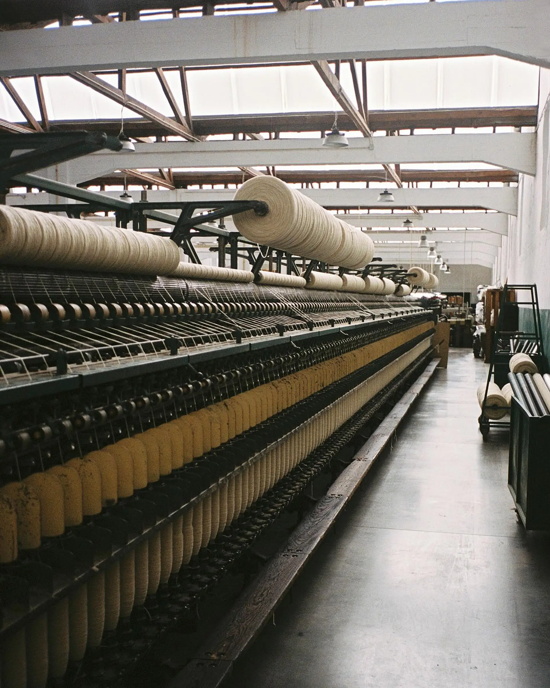 Wool spools lined up on 19th century refurbished weaving mills from Burel Factory