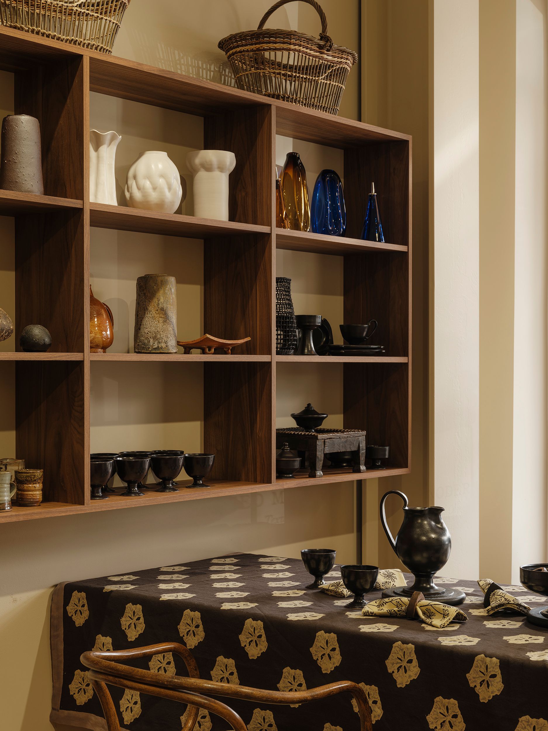 The Deuce front gallery at Handcrafted Modern in Ponsonby, Auckland, featuring custom Forte Alor walnut shelving, Studio Ford's Leaflet block-printed tablecloth, handcrafted ceramics, glassware and contemporary design objects.