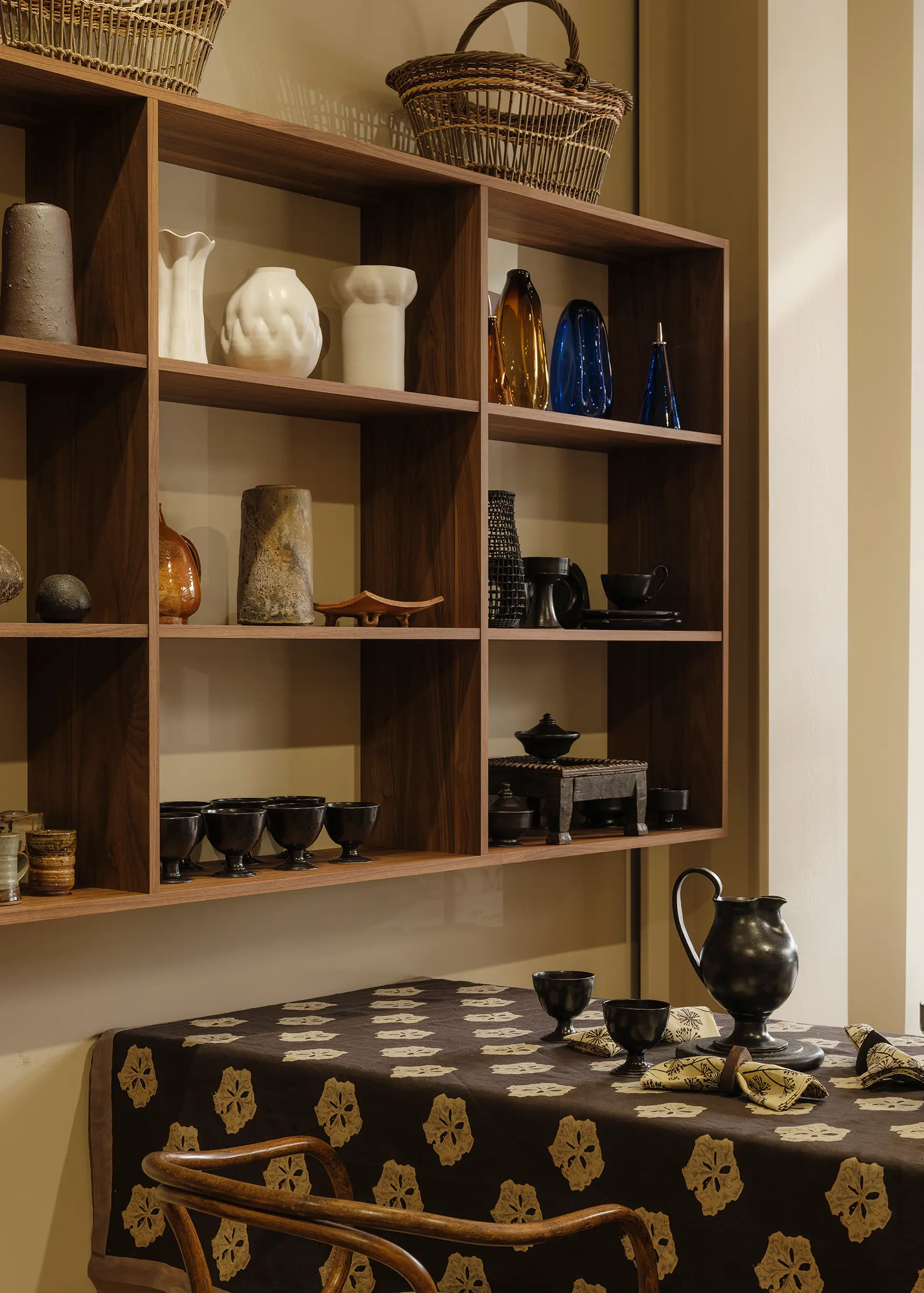 The Deuce front gallery at Handcrafted Modern in Ponsonby, Auckland, featuring custom Forte Alor walnut shelving, Studio Ford's Leaflet block-printed tablecloth, handcrafted ceramics, glassware and contemporary design objects.