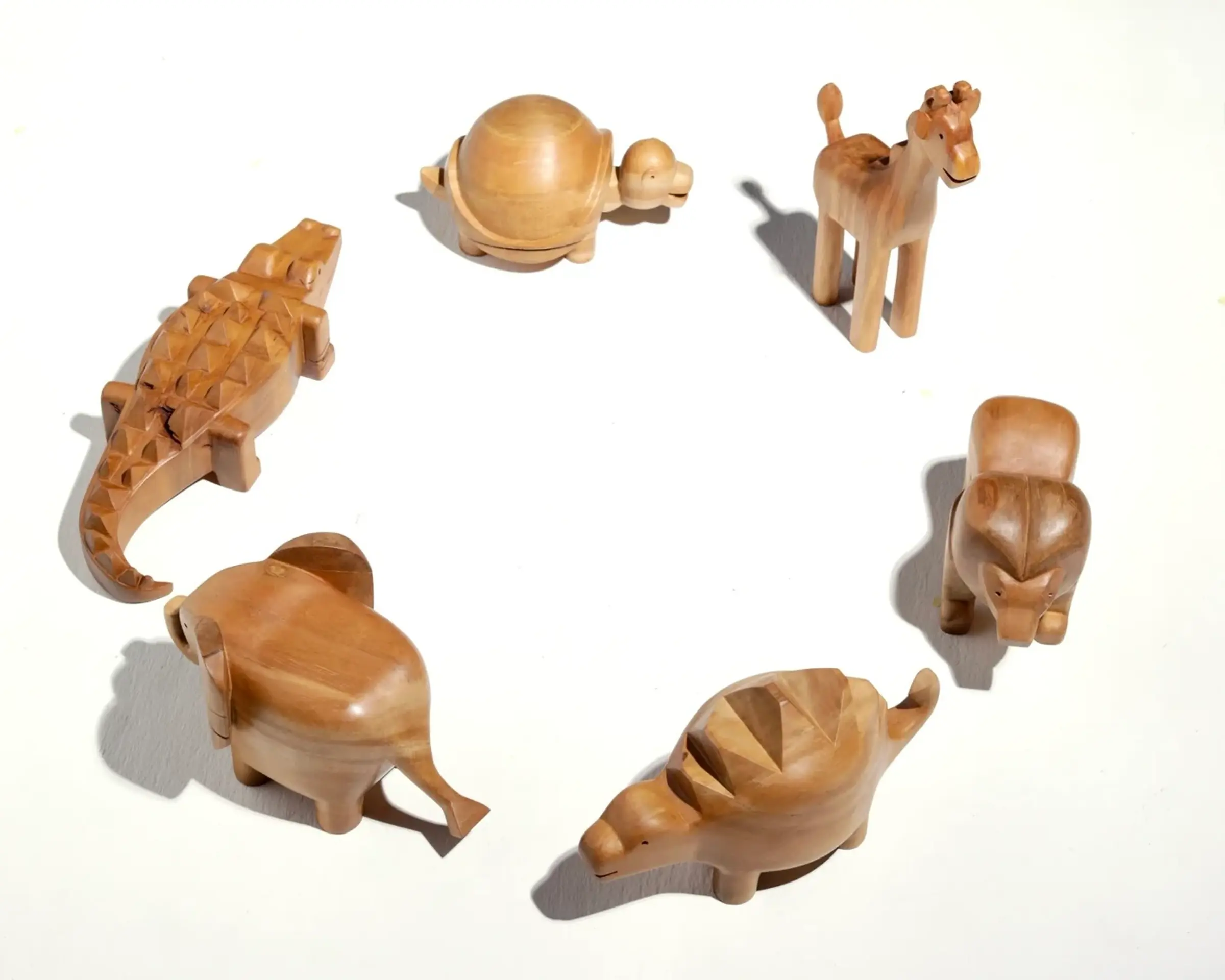 A collection of hand carved Animals by Courtney Petley, made with native timber