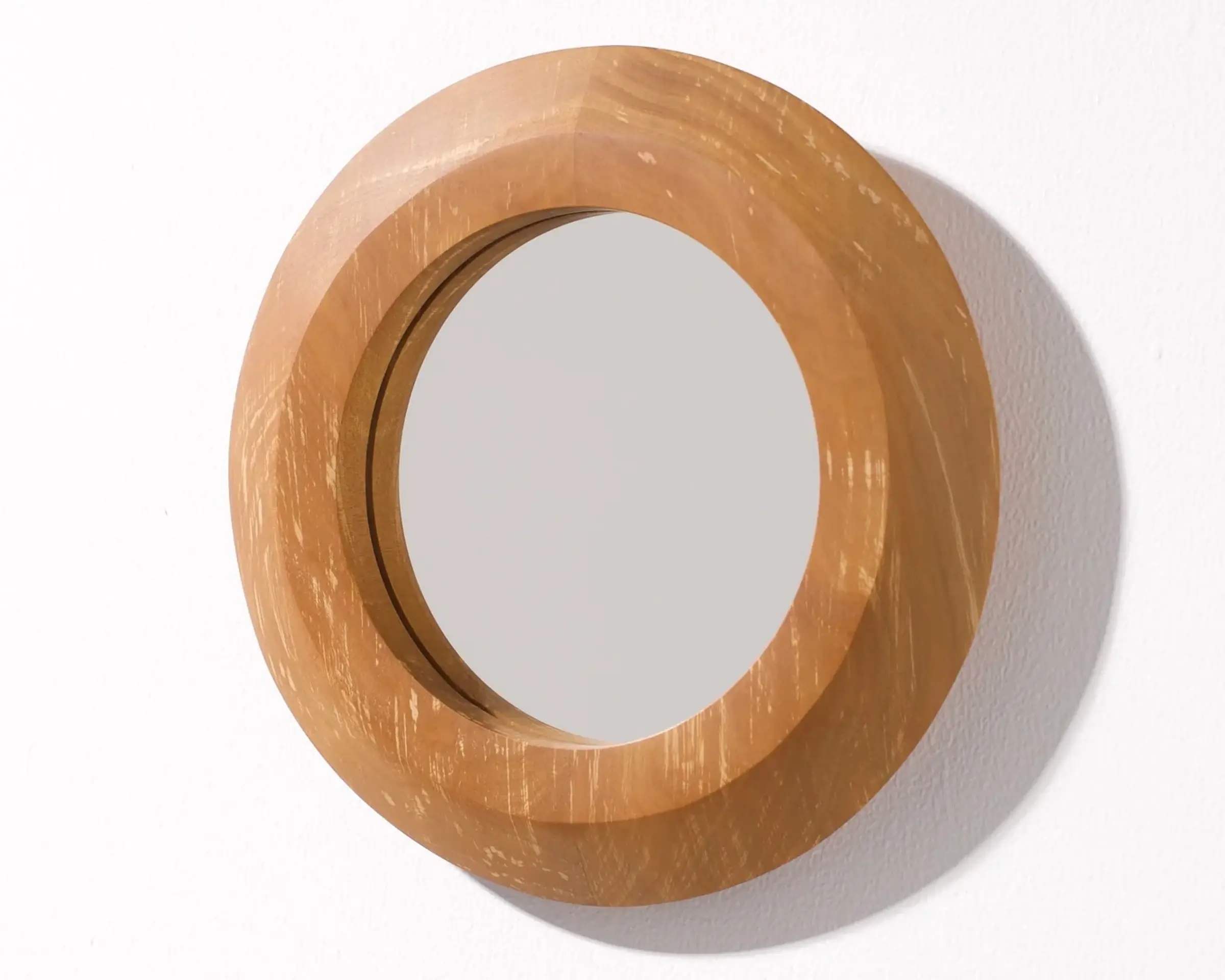 A hand carved mirror made from Swamp kauri made by New Zealand wood worker Courtney Petley