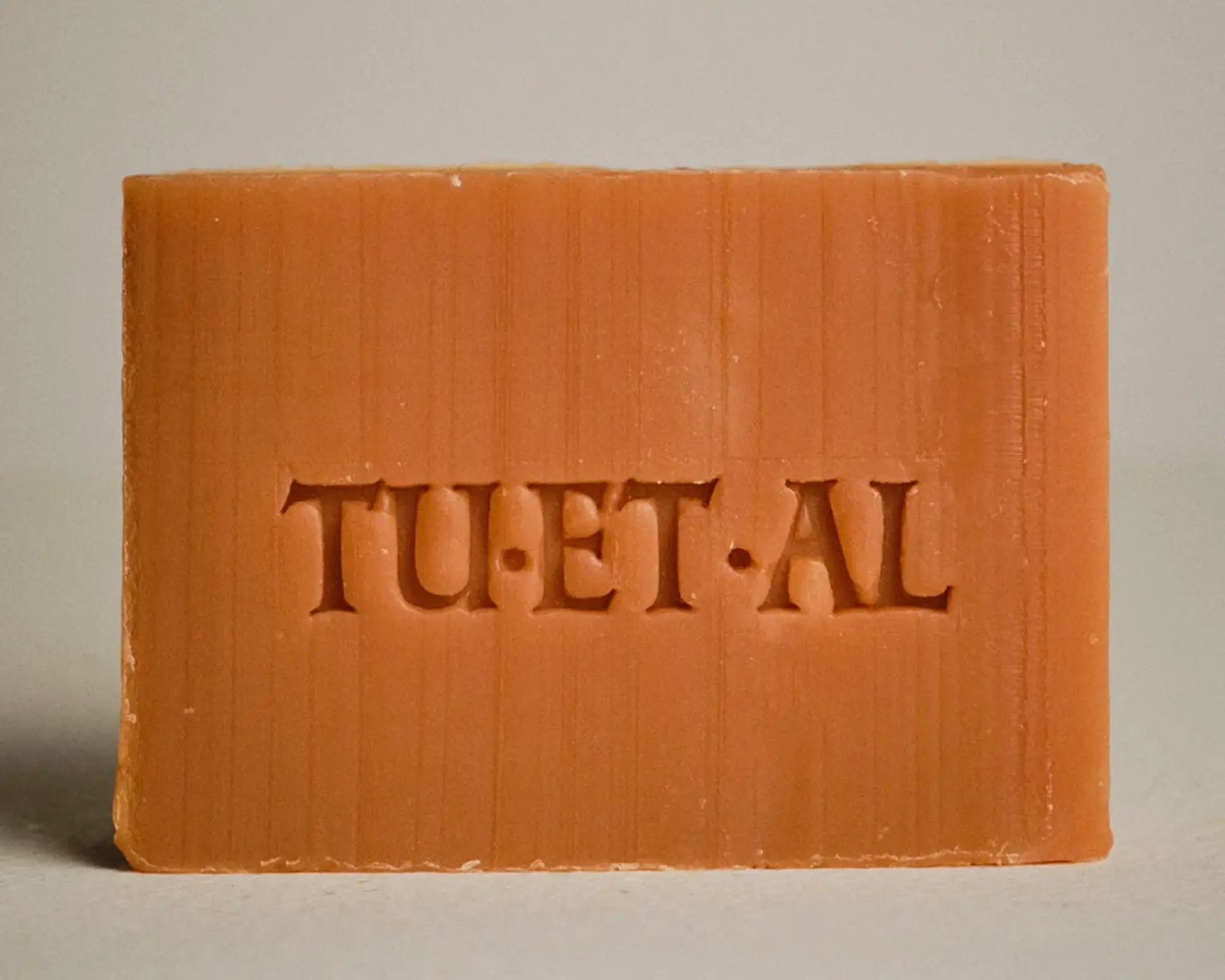 bar of peach orange coloured soap