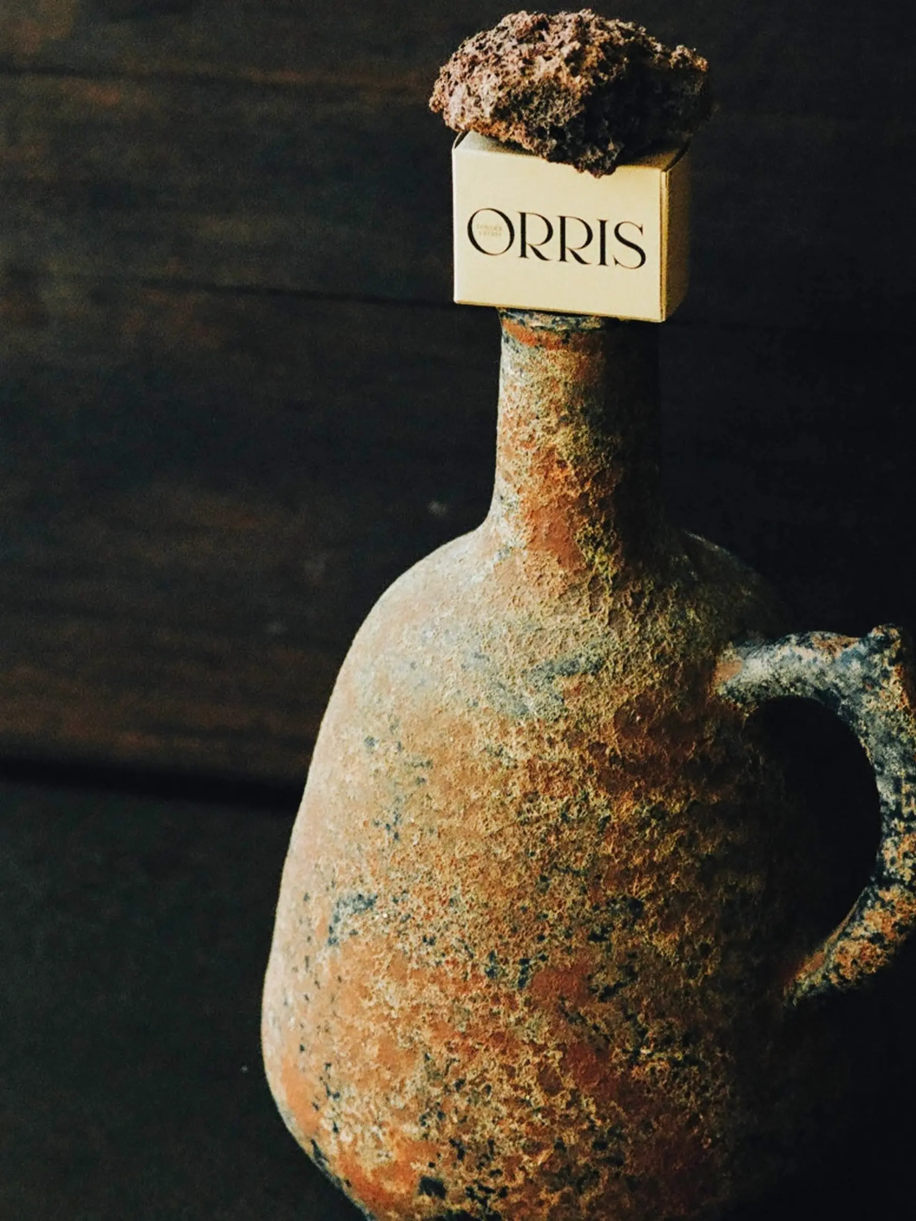 Orris soap box on a ceramic jug