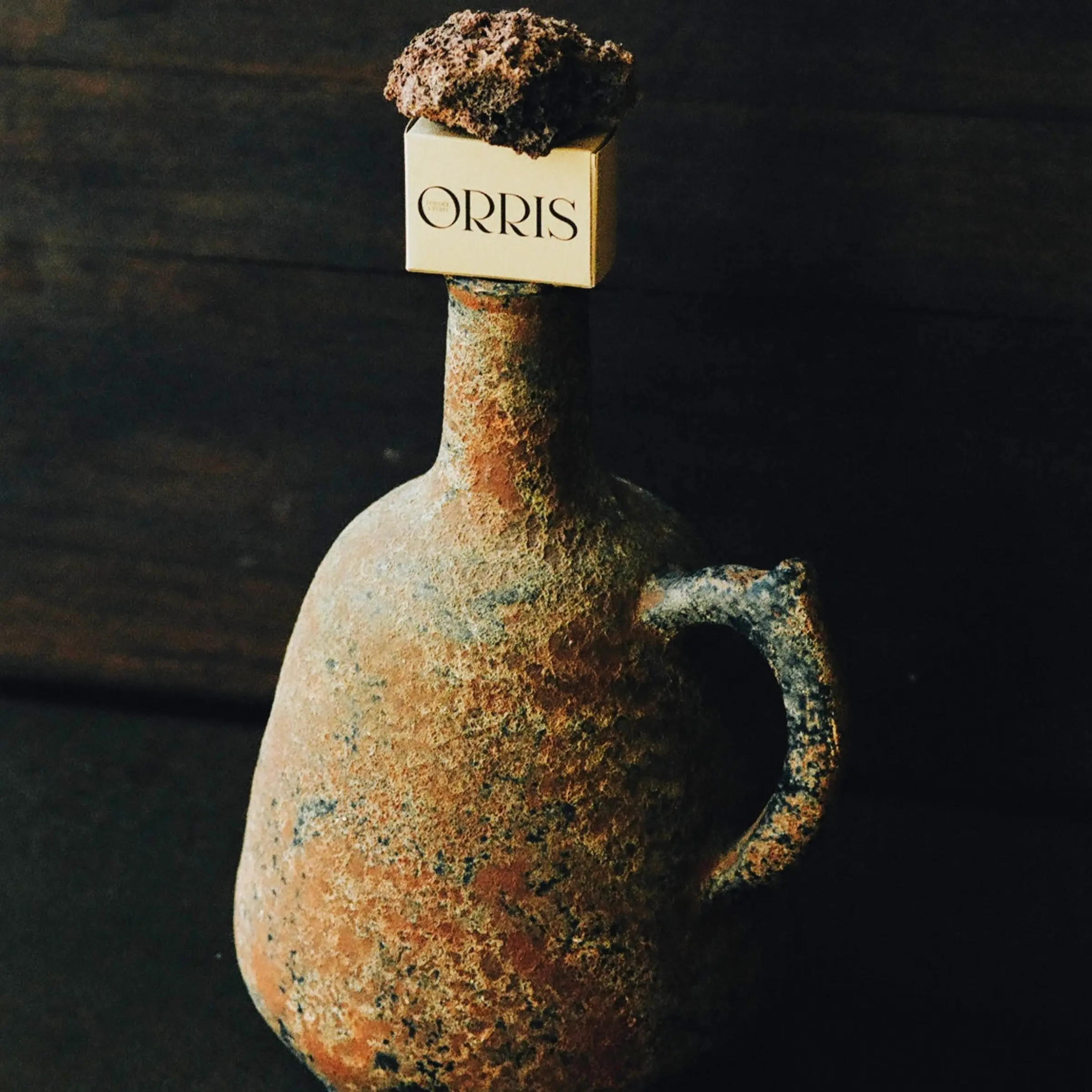 Orris soap box on a ceramic jug