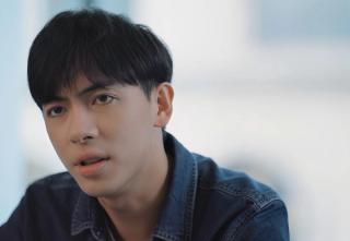 Leon Hong plays a serious character in a modern office