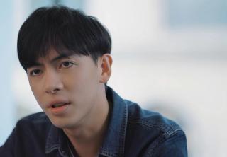 Leon Hong plays a serious character in a modern office