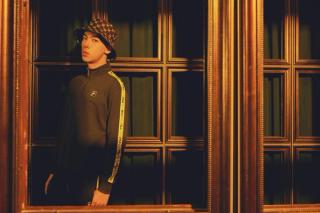 Leon Hong modelling in a wooden scene