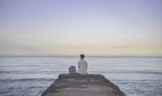 Leon Hong sits by the ocean in Northern Taiwan
