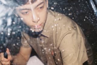 Leon Hong modelling under an umbrella