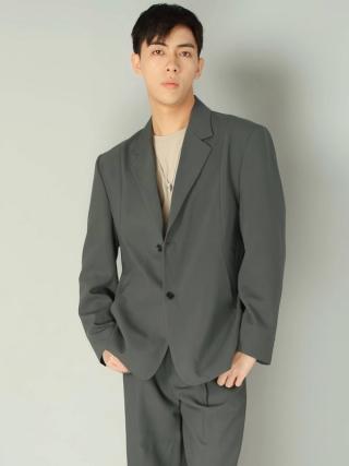 Leon Hong wears a smart green Korean suit.