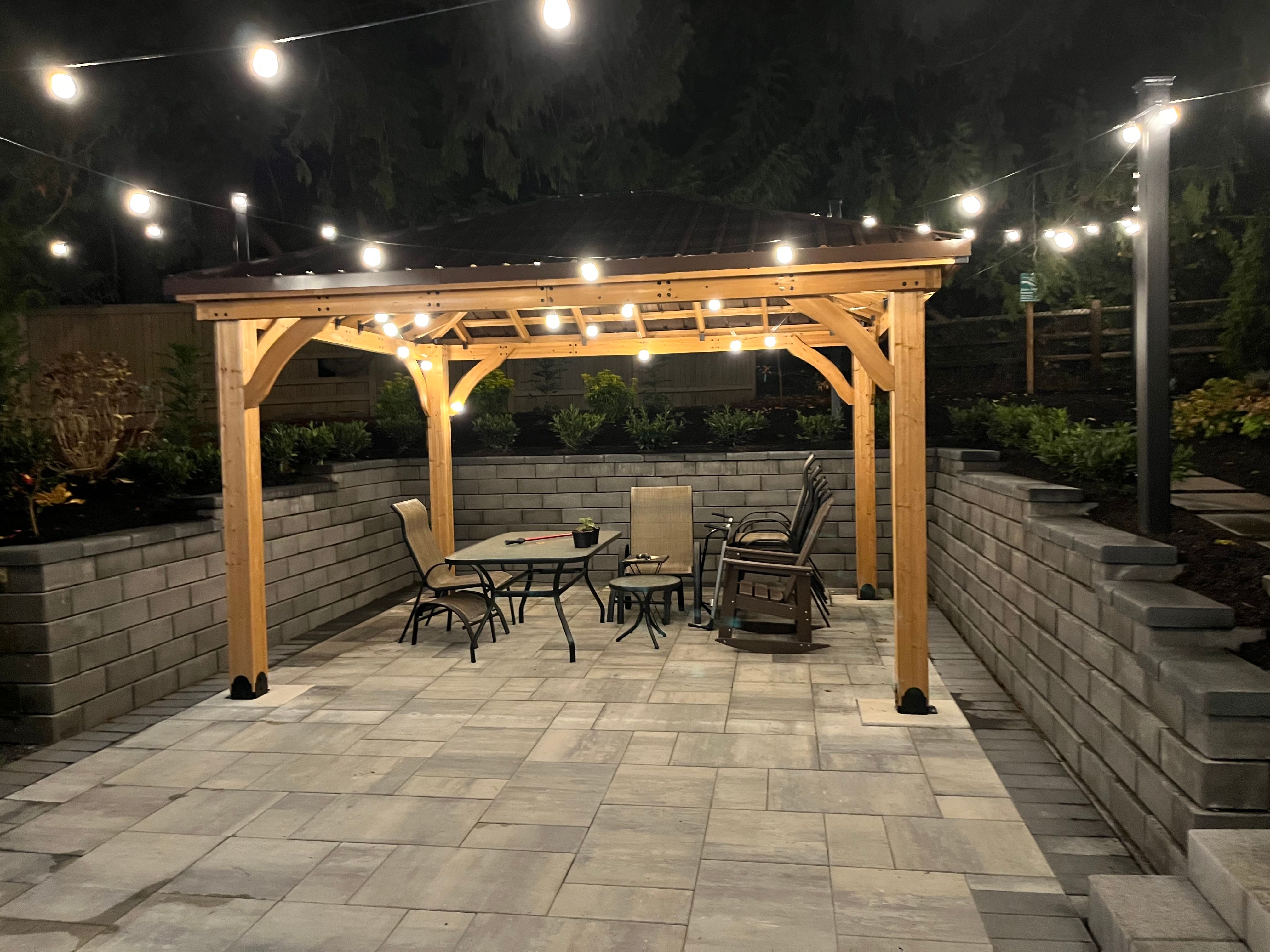 Custom wood pergola and deck in a residential backyard