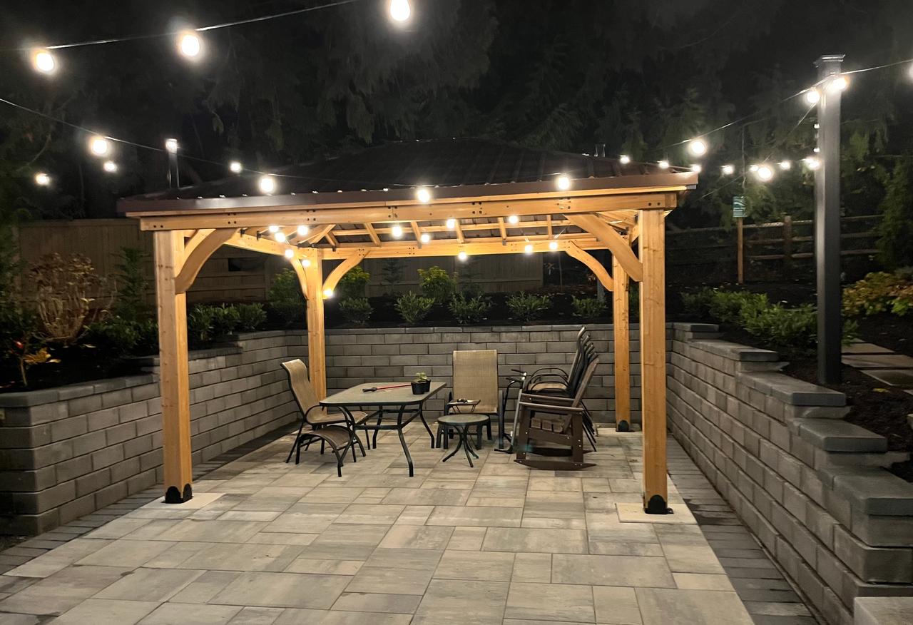 Custom wood pergola and deck in a residential backyard