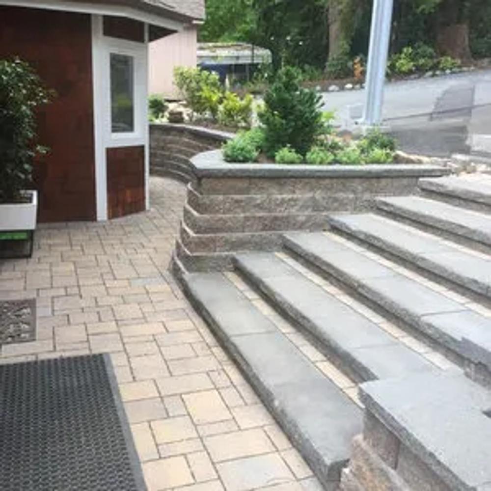 Retaining wall integrated with patio space