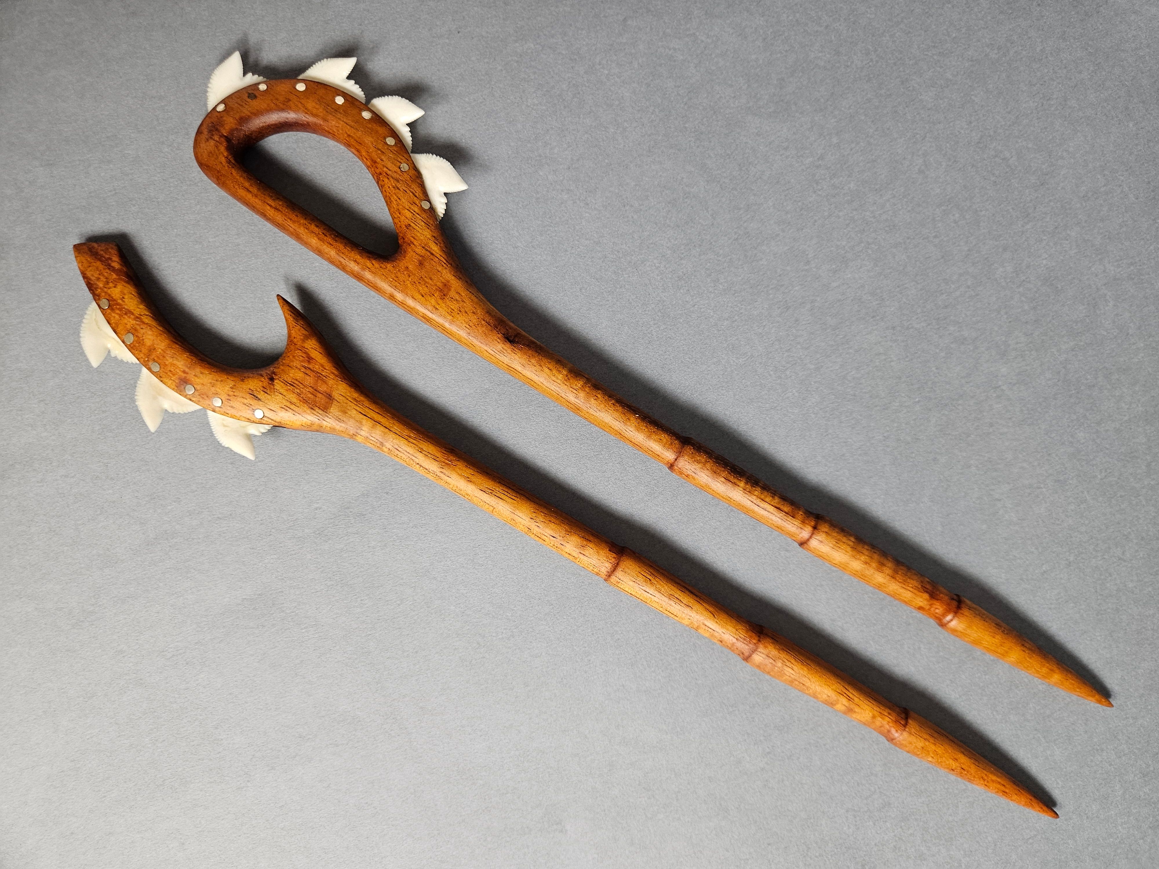 These two hair picks draw inspiration from traditional Hawaiian war clubs called Leiomano