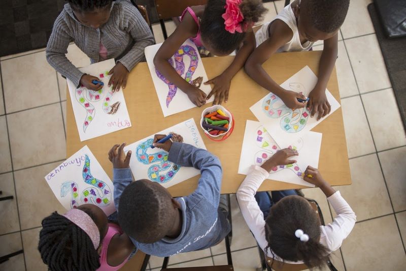 Children colouring in at Khumbulani