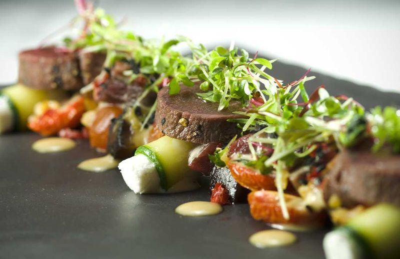 Springbok tataki and tartar, goat’s cheese, asparagus, pickled shiitake mushrooms, lemon preserve and sesame seeds
