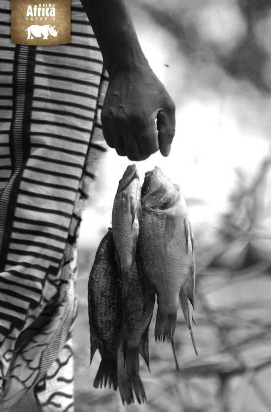 A local fisherman carries his catch