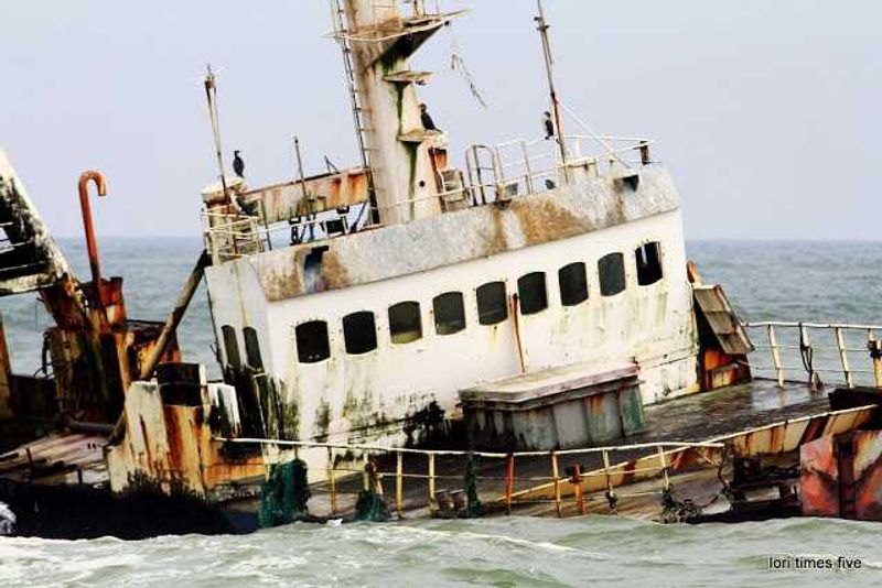 "This is an old fishing boat out of Angola. Beached four years ago. Her name is Sela. Now seabirds use her to nest on." 
