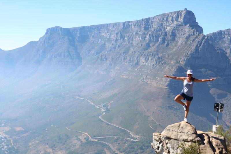 Woman hiking in Cape Town with Table Mountain in the background