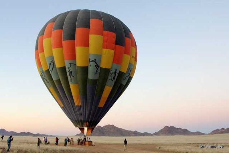  "After a while of floating over stunning landscapes where we could see for miles, the balloon was lowered. We could see animals and birds now! We were above a kestral hunting, and I spotted a black - backed jackel that had just dug up an ostrich egg and he was batting it around. Incredible!"