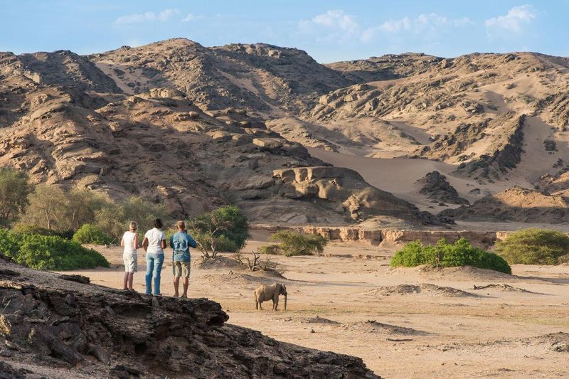 Safari goers on foot near Hoanib Skeleton Coast Lodge in Namibia