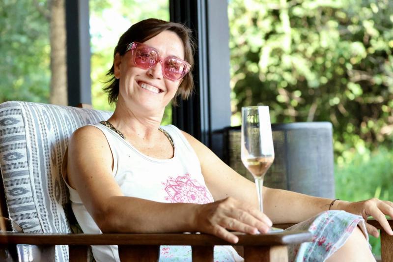 Landy Kent-Millar, Rhino Africa Travel Expert at Tanda Tula enjoying a glass of CC