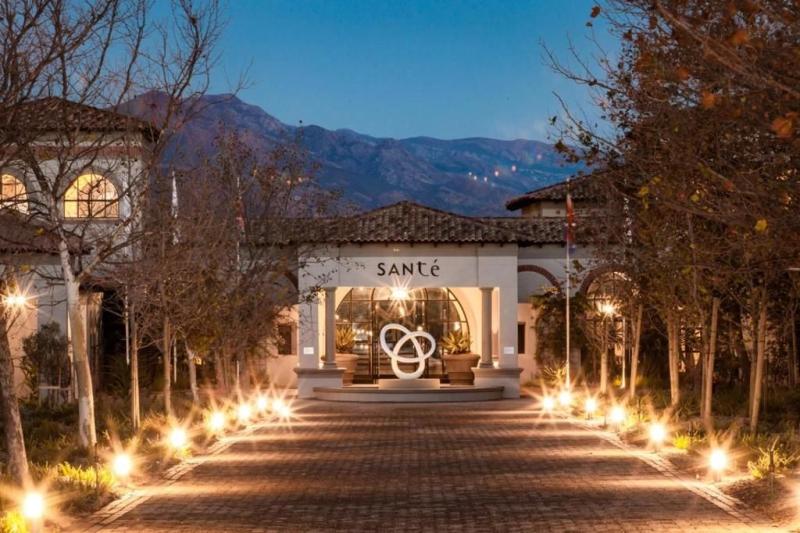 The entrance to Sante Wellness Retreat in the Cape Winelands, framed by mountains
