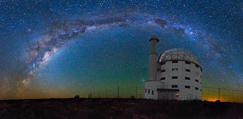 Night sky full of stars with the Sutherland observatory in view