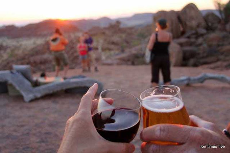 On reaching the Mowani Mountain Camp, the Grahams were "greeted with cold wet towels and ice filled drinks and then kindly hurried through reception and up to the viewing rock, so we wouldn't miss sundowners of this kind...”
