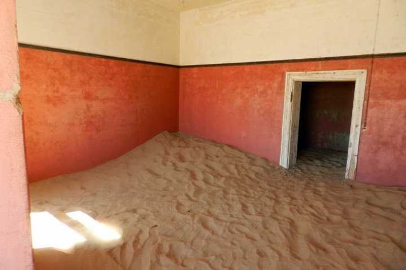 Abandoned houses inKolmanskop, near Luderitz. "The elegant houses are being demolished by the wind, and the desert is gradually reclaiming the land."