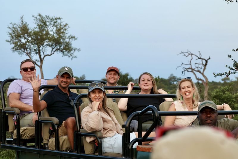 Rhino Africa Travel Experts on a game drive vehicle on safari with Tanda Tula