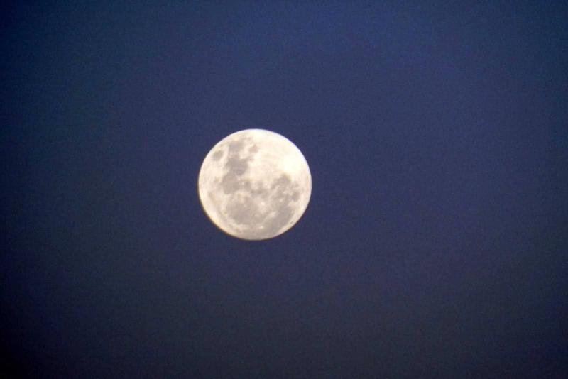 Sun sets and a full moon in Windhoek