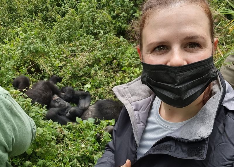 Allison in front of two gorilla juveniles