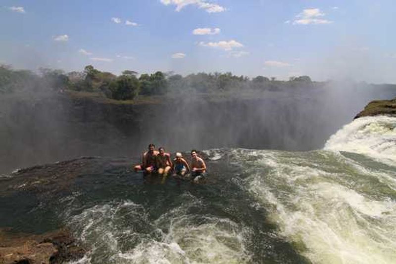 Dive into Devil's Pool overlooking Victoria Falls