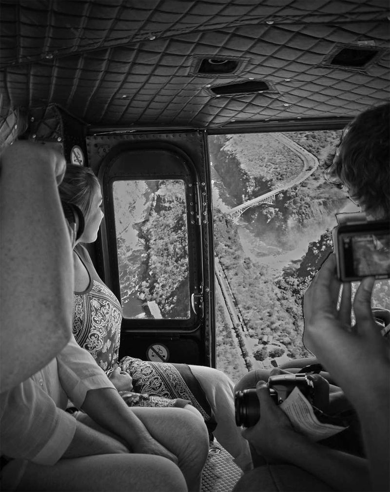The main building is on a small hill and offered a breathtaking view of the spray from the waterfall. Located on the deck was also a friendly gentleman playing the Marimba. We met Lizelle who gave us a brief introduction about the helicopter flight and another part of the staff explained the flight routing. The helicopter flight was around Victoria Falls, as well as straight over the Falls, and then over the national park area.
