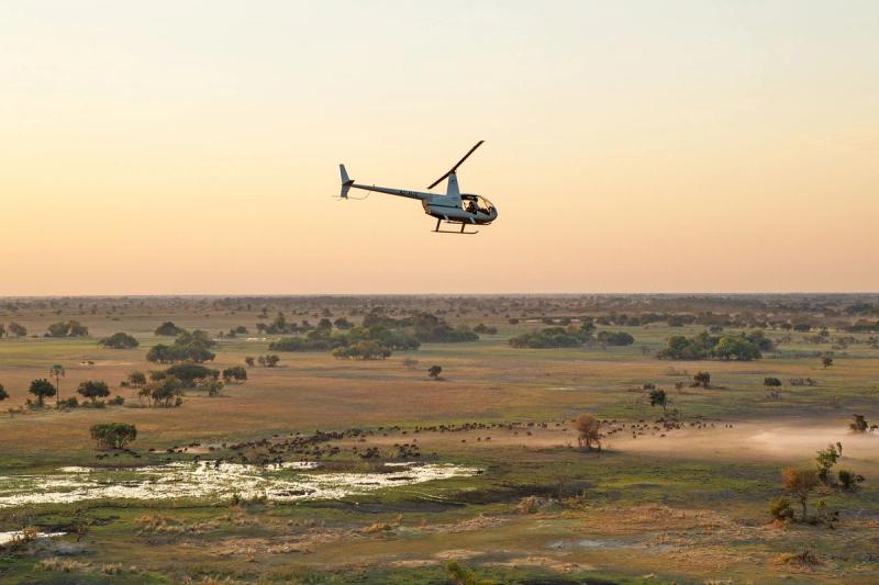A helicopter flying over the Okavango Delta in Botswana, Image Credit: Camp Okavango