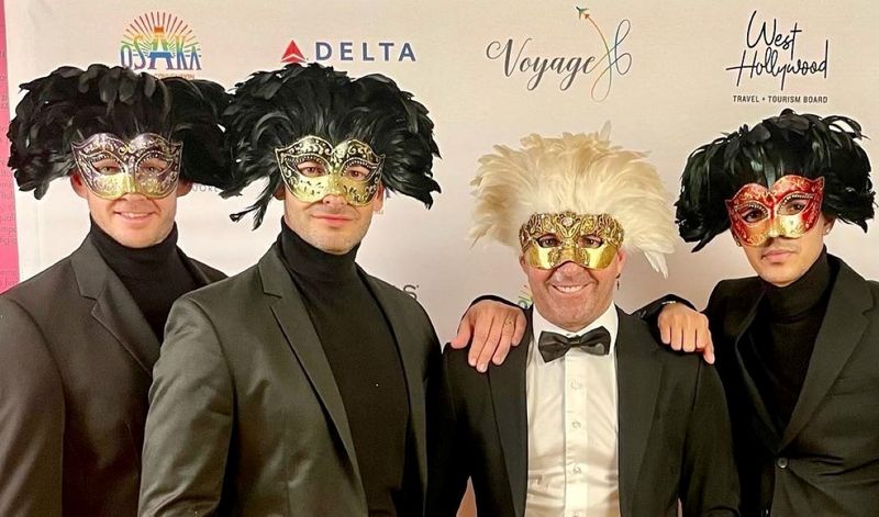 Rhino representatives wearing feathered masks