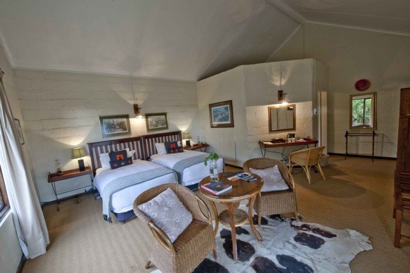 Ein Schlafzimmer des Fugitives Drift Guest House in KwaZulu-Natal