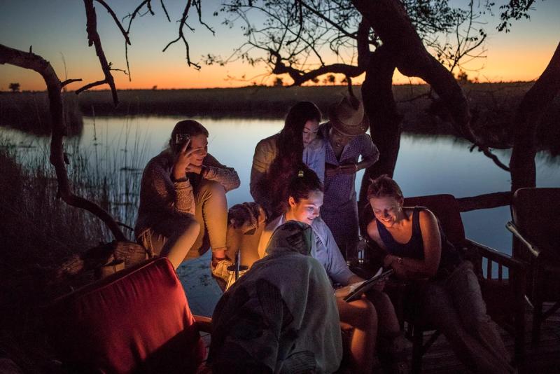 Looking at photos in the okavango delta