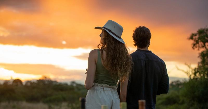 Couple taking in an African sunset