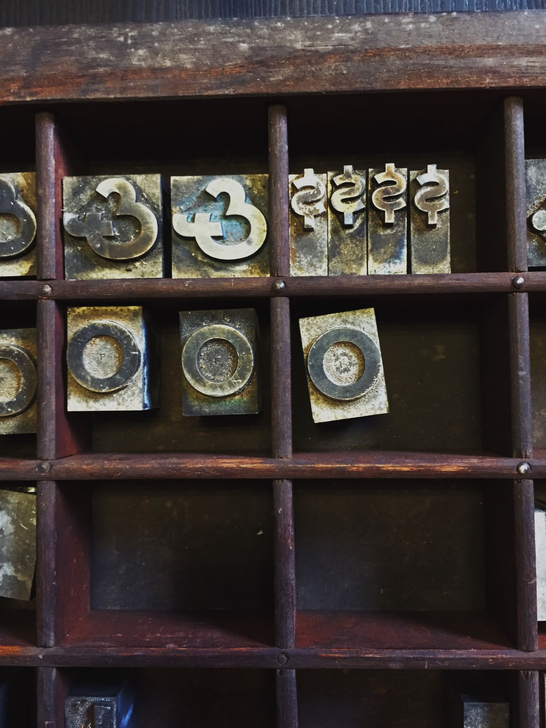 Metal type in a typesetting case.