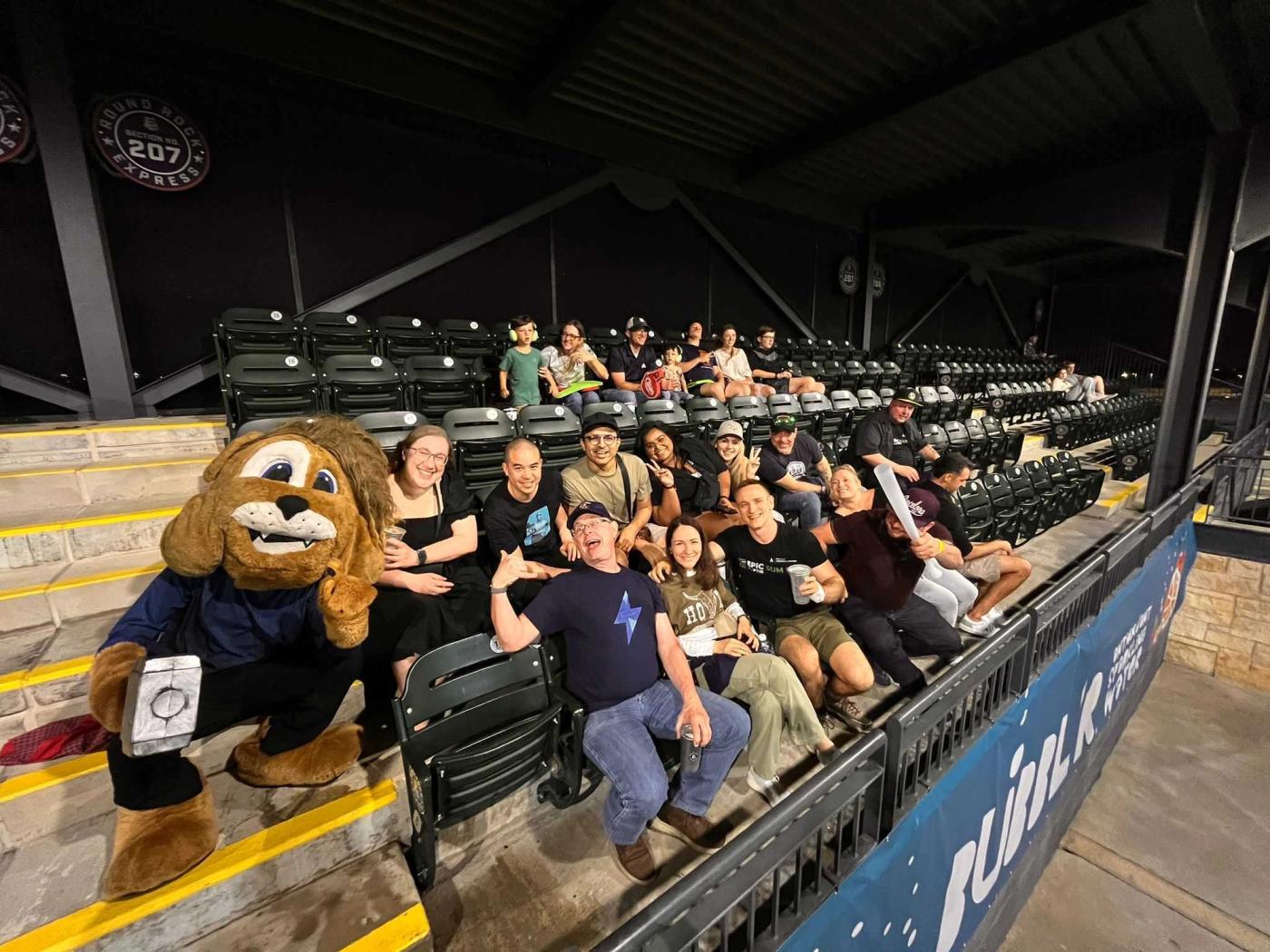 Members of TAG and Upscale at a baseball game